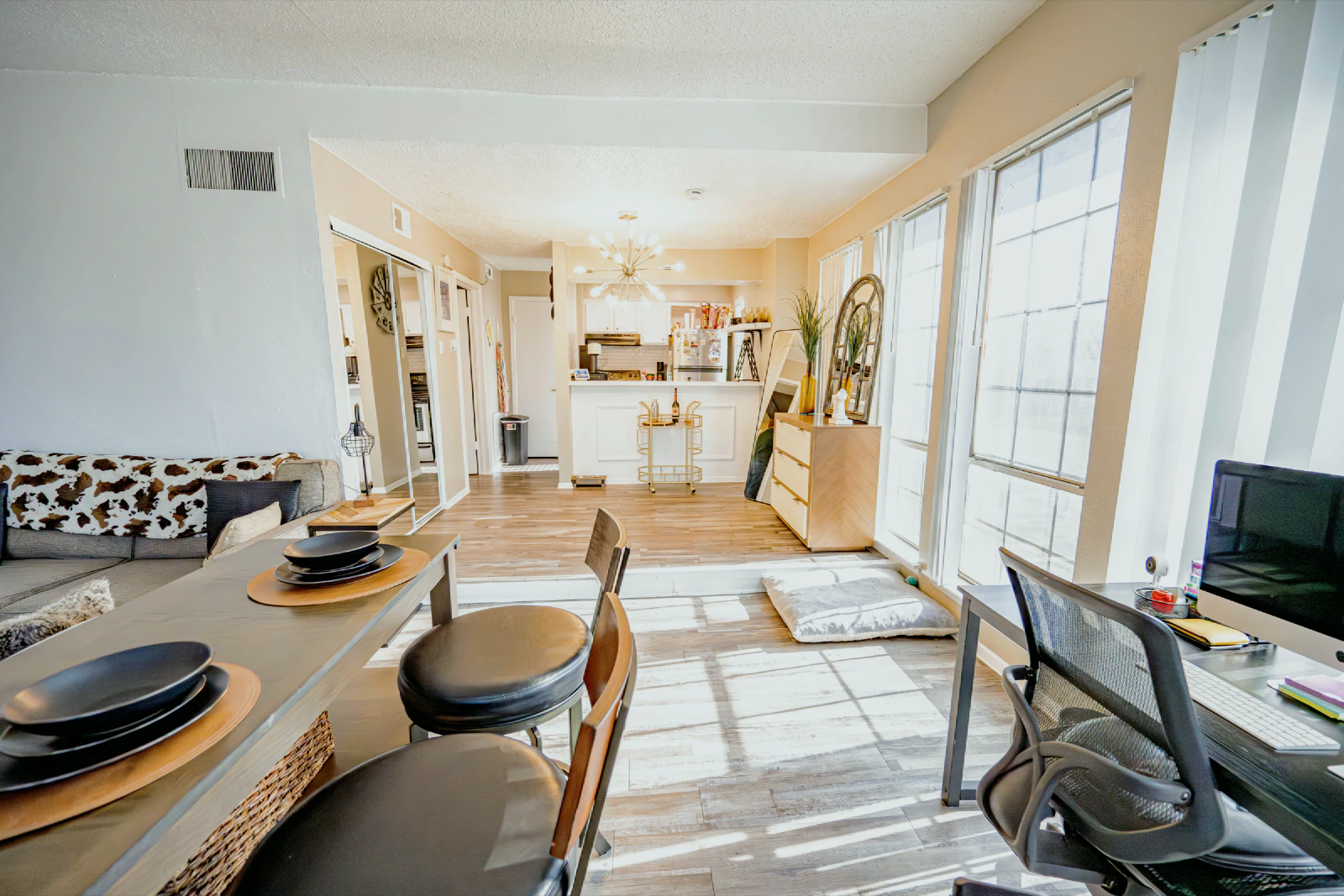 Open dining area looking toward a Villa Encanto apartment kitchen