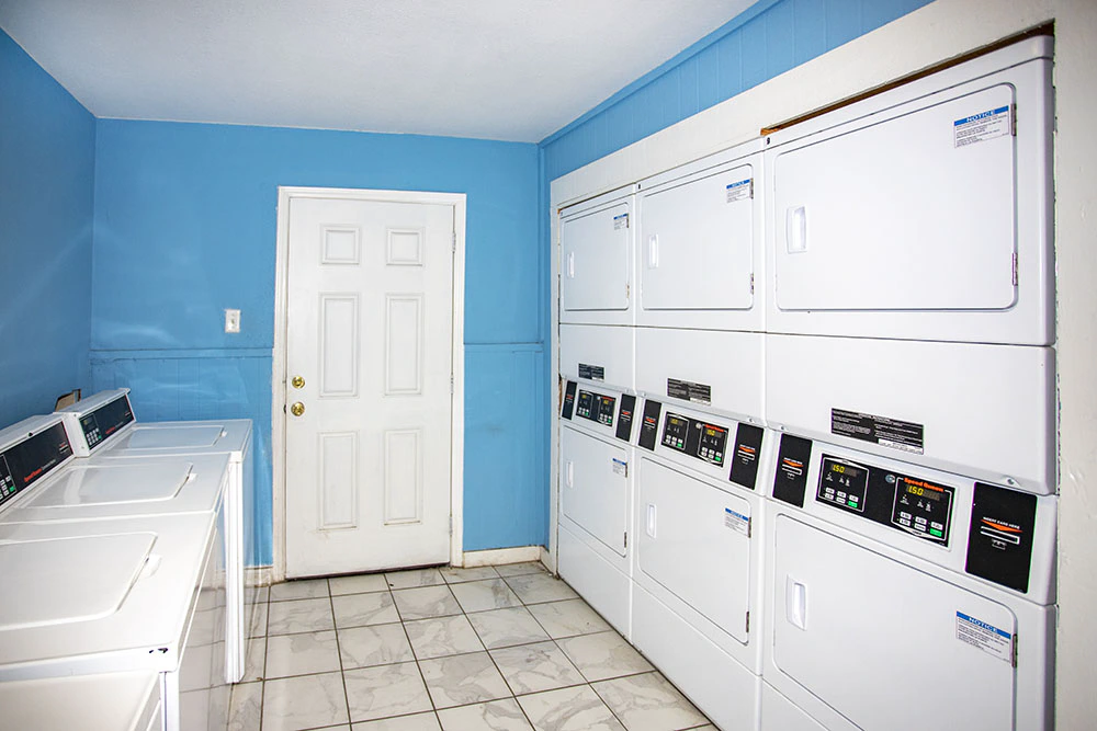 Villa Encanto on-site laundry room with multiple washers and dryers